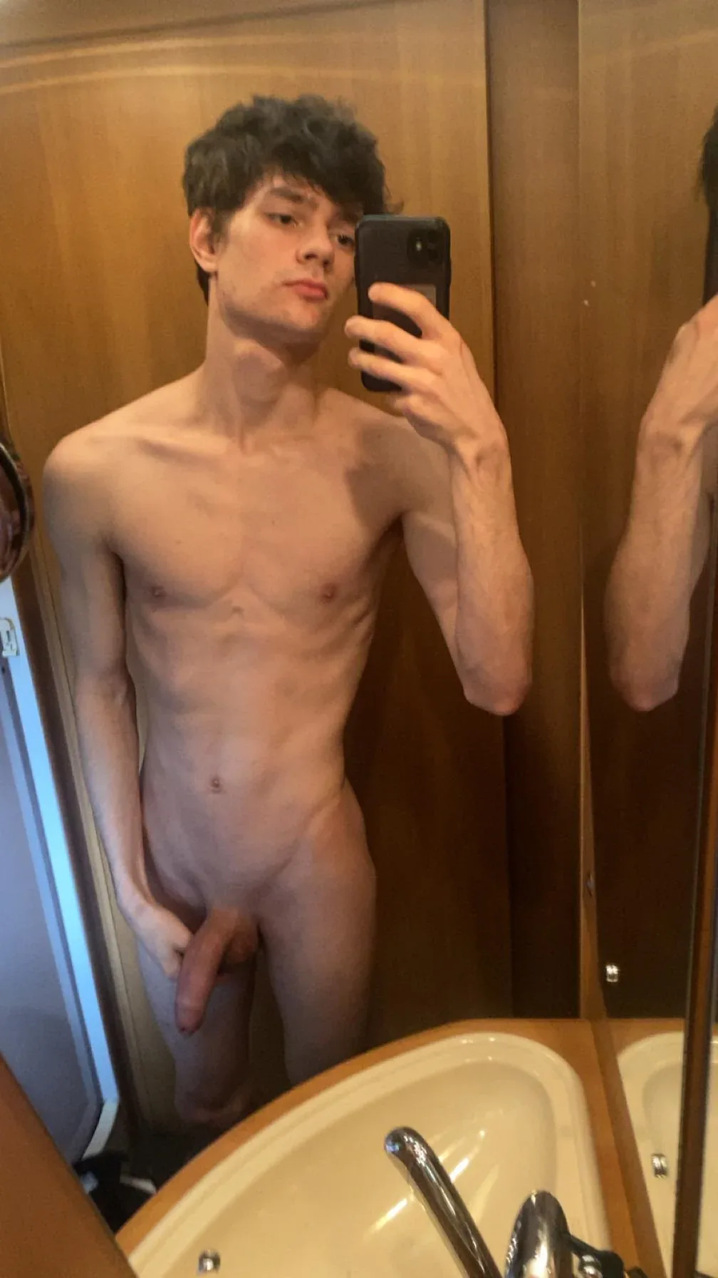 Skinny twink takes mirror selfies showing off his hard cock and tight ass in the bathroom - photo 3