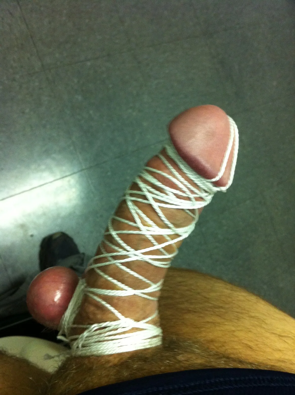 Hard cock and balls wrapped tight in rope, feet bound too, kinky guy playing dirty - photo 4