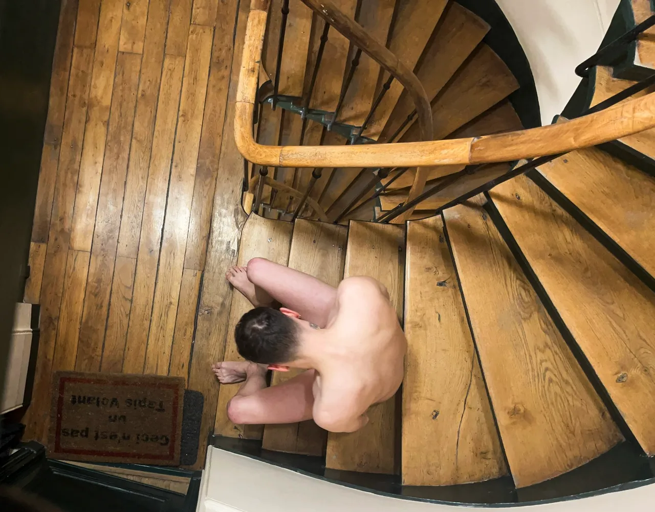 Naughty lad caught bare-assed on the spiral stairs, cheeky pose for the camera - photo 1