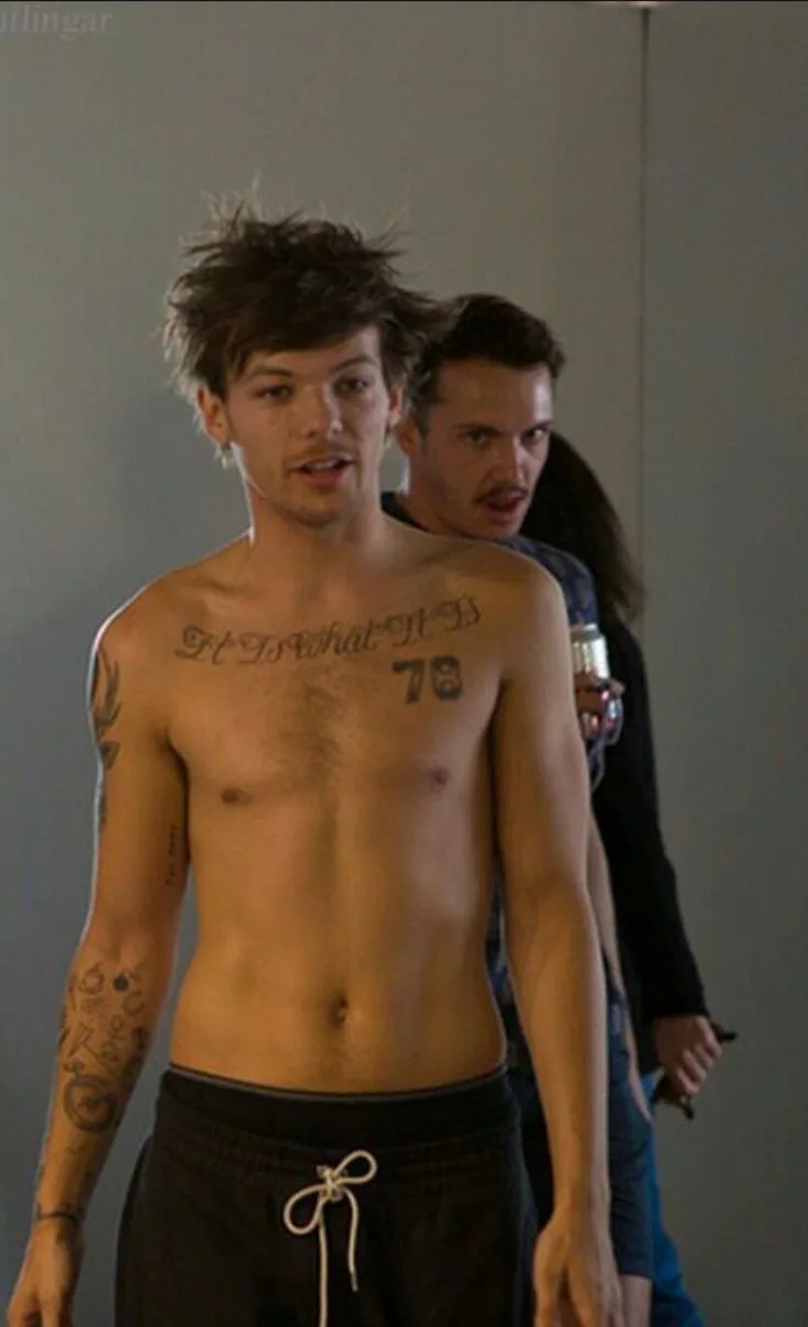 Shirtless Louis Tomlinson flaunts inked abs and messy hair in casual studio snap