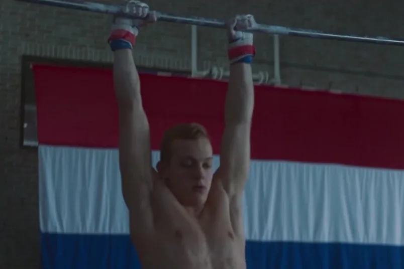 David Wristers shirtless under shower spray with intense gaze - photo 2