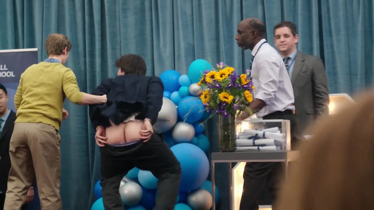 Aran Murphy’s cheeky bare ass flash during chaotic stage moment, suit pulled up for full mooning view - photo 5