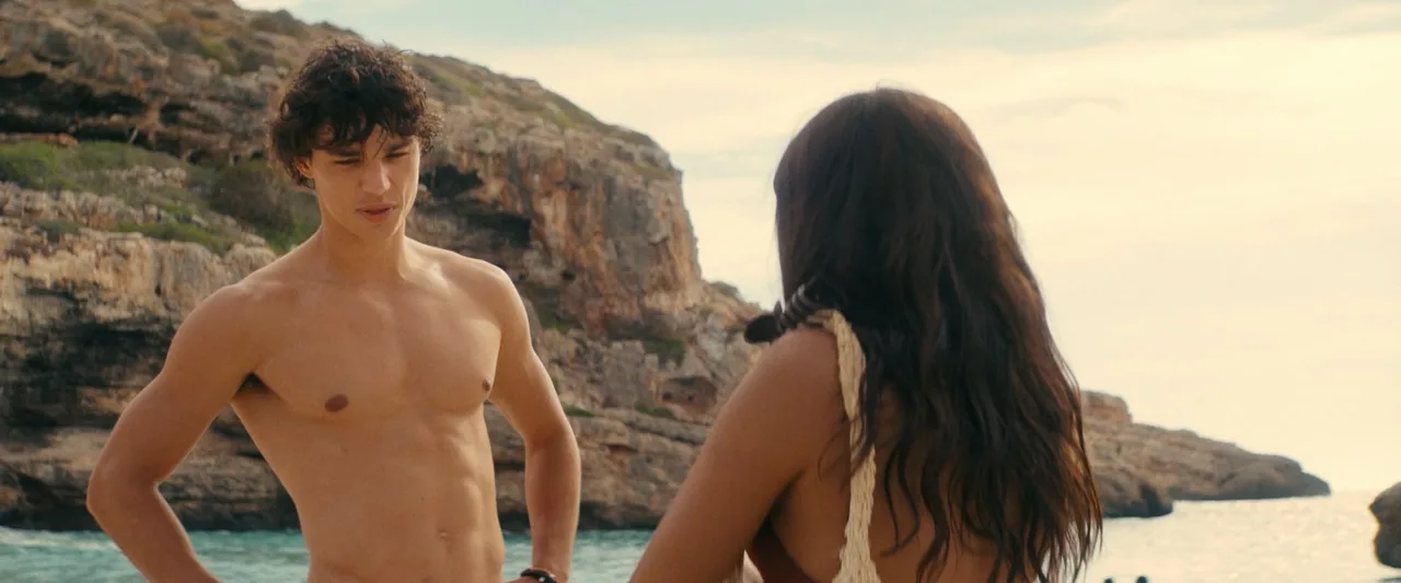 Fernando Lindez bare-chested and nude from behind on rugged beach, muscular physique on display near rocky shore - photo 4