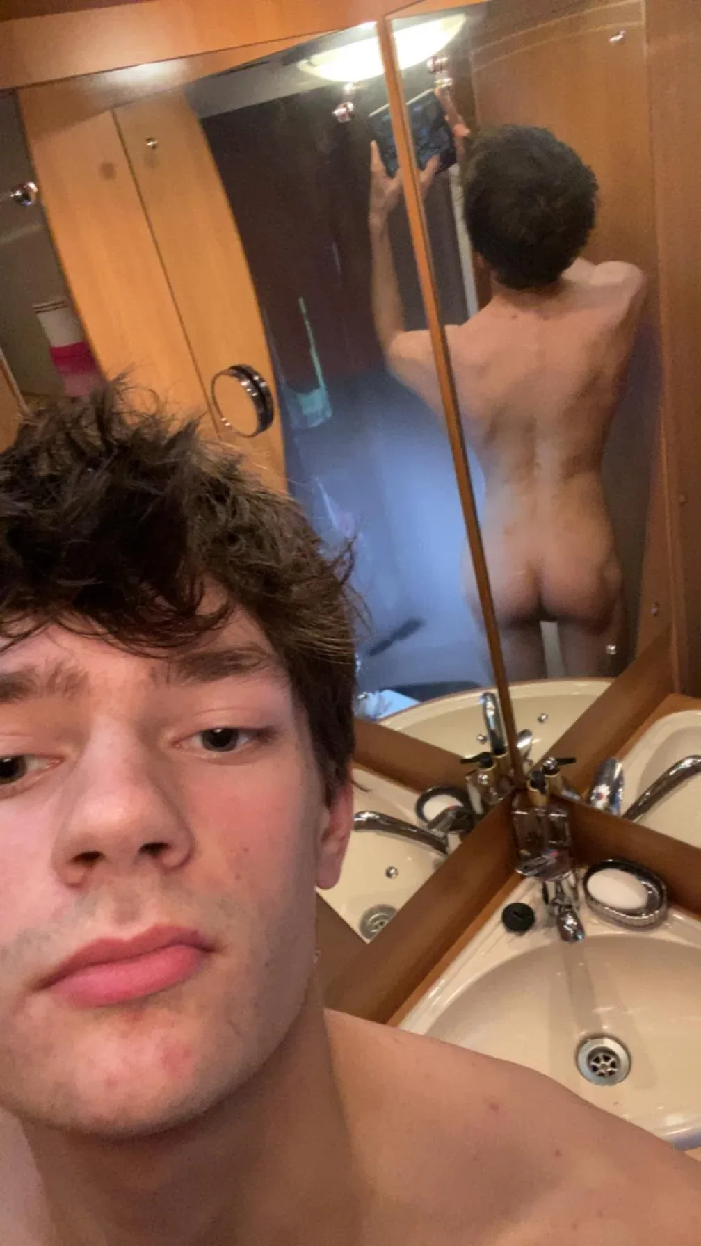 Skinny twink takes mirror selfies showing off his hard cock and tight ass in the bathroom - photo 2