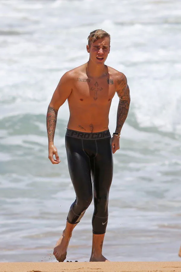 Justin Bieber Shirtless on the Beach in Black Swim Tights