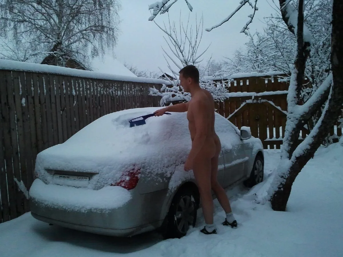 Snowy exhibitionist lad posing naked on car with cock out, showing off in winter - photo 3