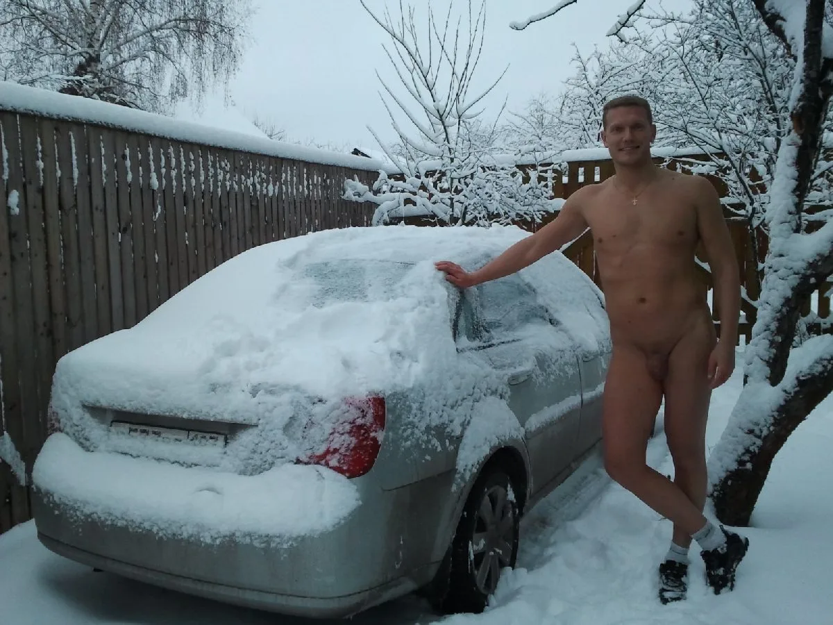 Snowy exhibitionist lad posing naked on car with cock out, showing off in winter - photo 4
