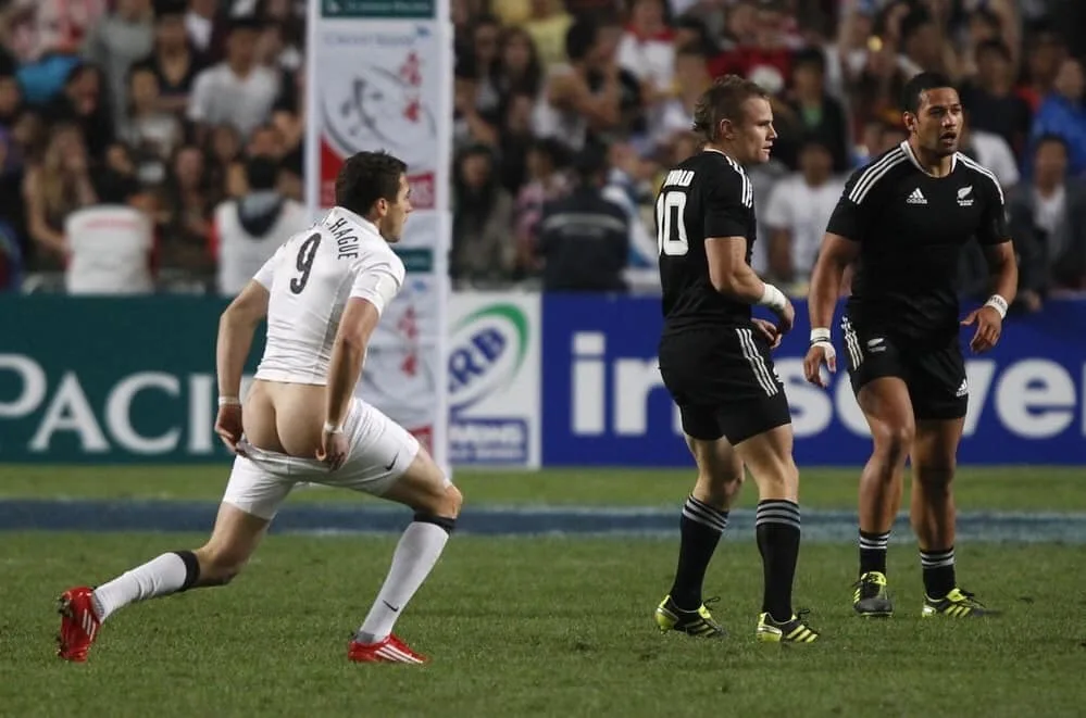 Naughty rugby lad flashes cheeky bare ass mid-game, mates look on clueless