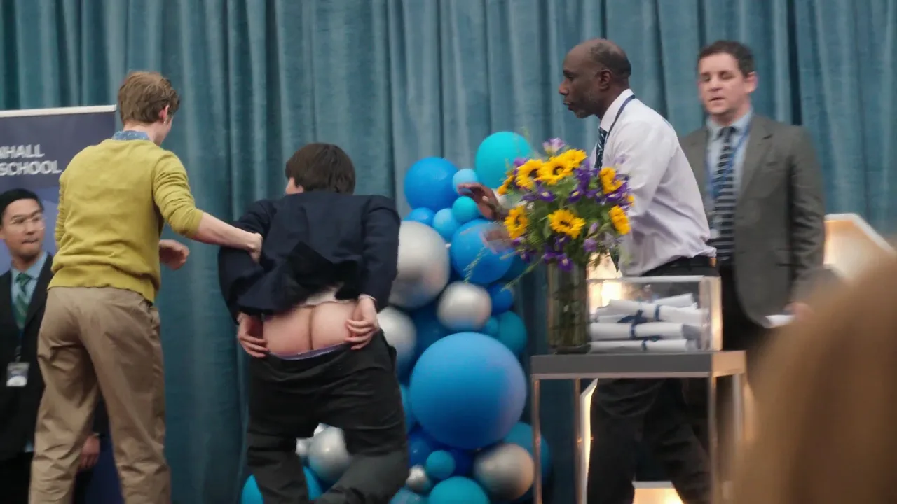 Aran Murphy’s cheeky bare ass flash during chaotic stage moment, suit pulled up for full mooning view - photo 6