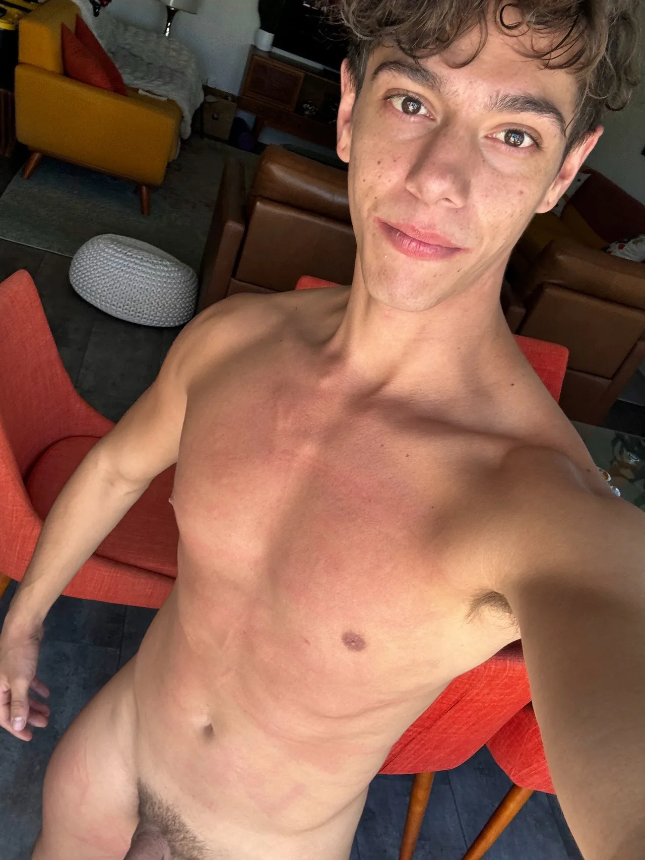 Twink guy selfie showing bare chest and abs, pubic hair visible, no cock or balls in frame
