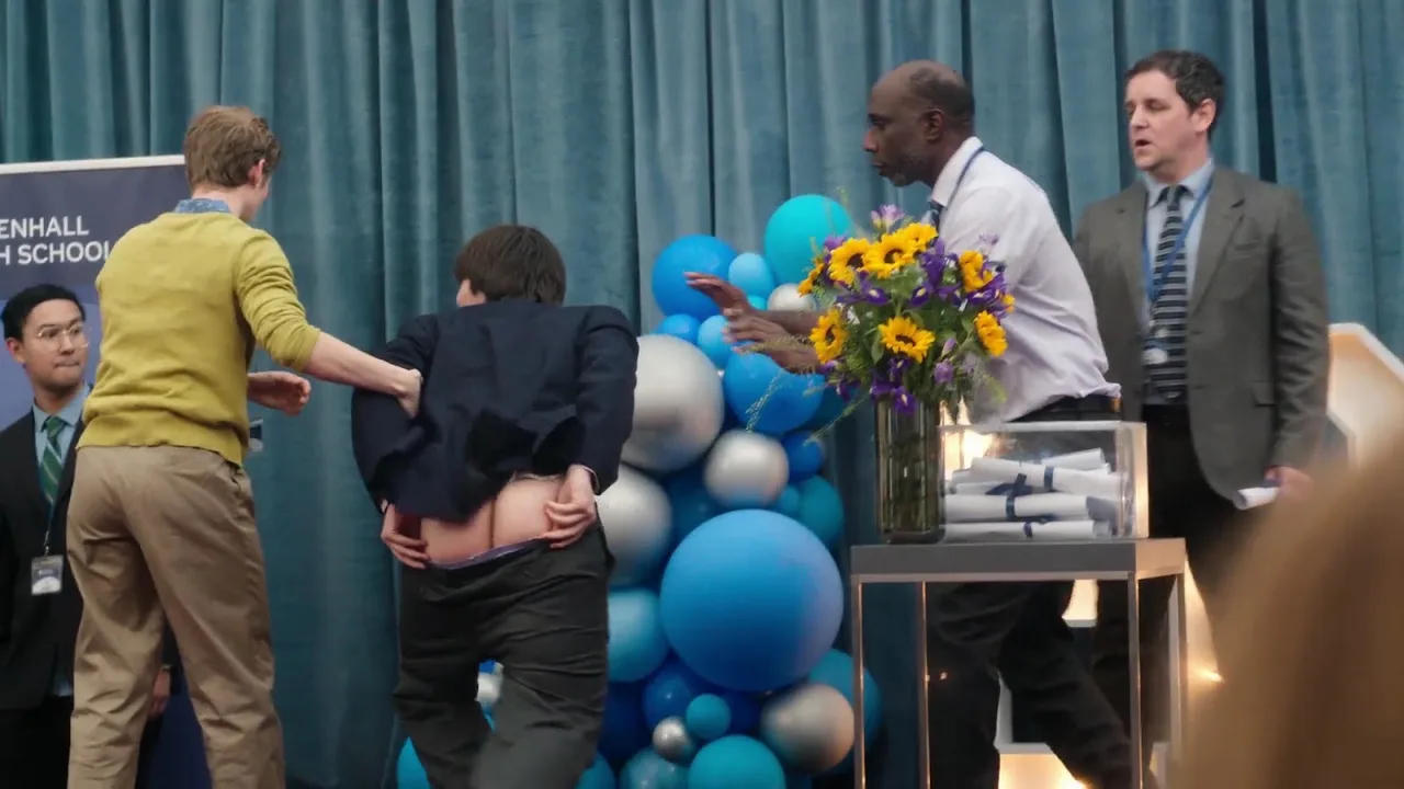 Aran Murphy’s cheeky bare ass flash during chaotic stage moment, suit pulled up for full mooning view - photo 7