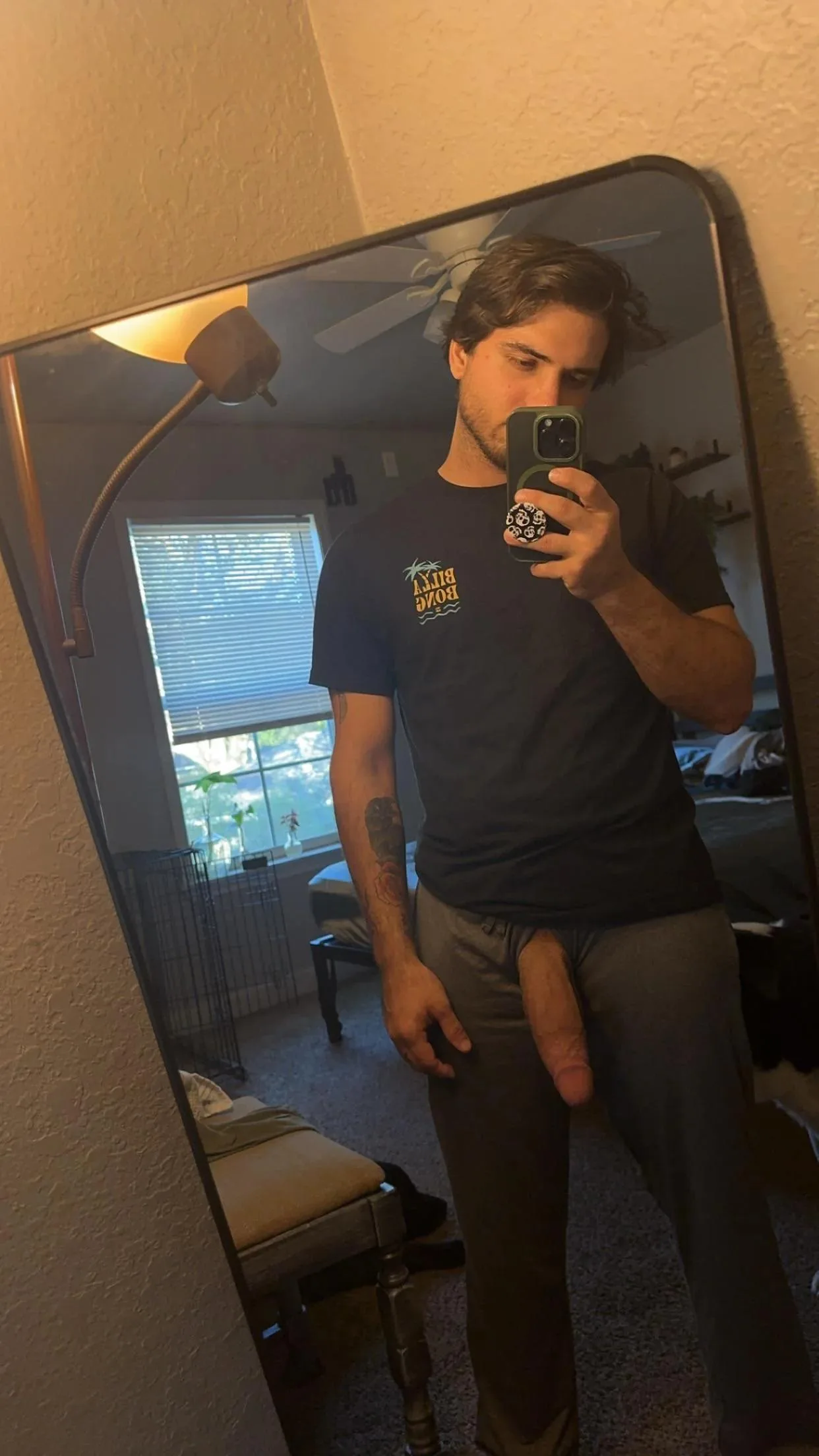Hot amateur guy takes mirror selfie with hard cock hanging out of his pants