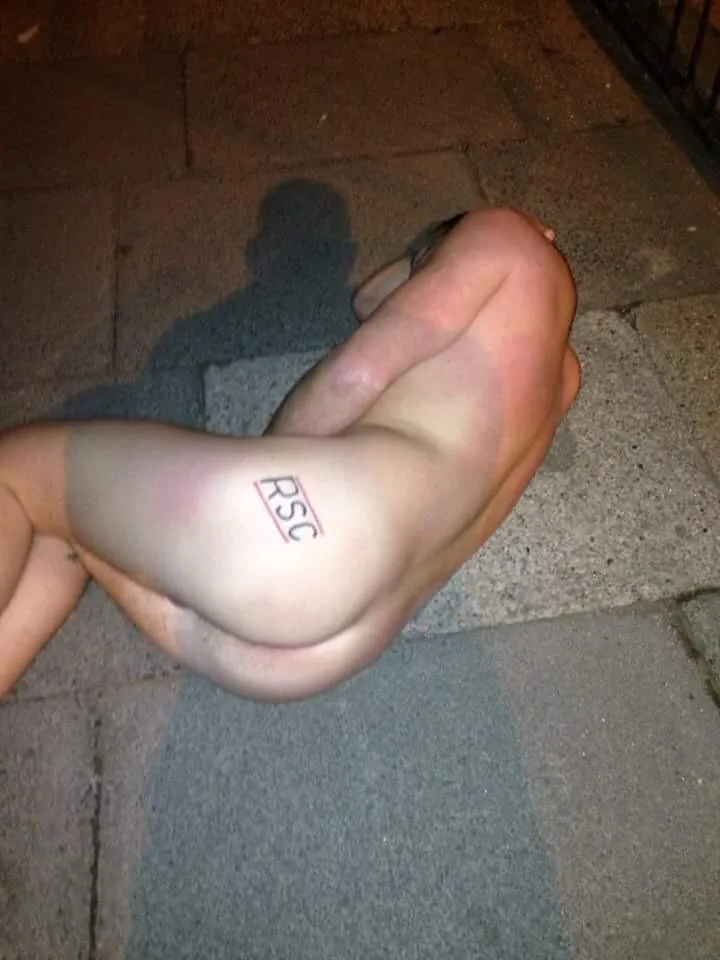 Naughty lad bent over showing off his bare ass with RSC tattoo