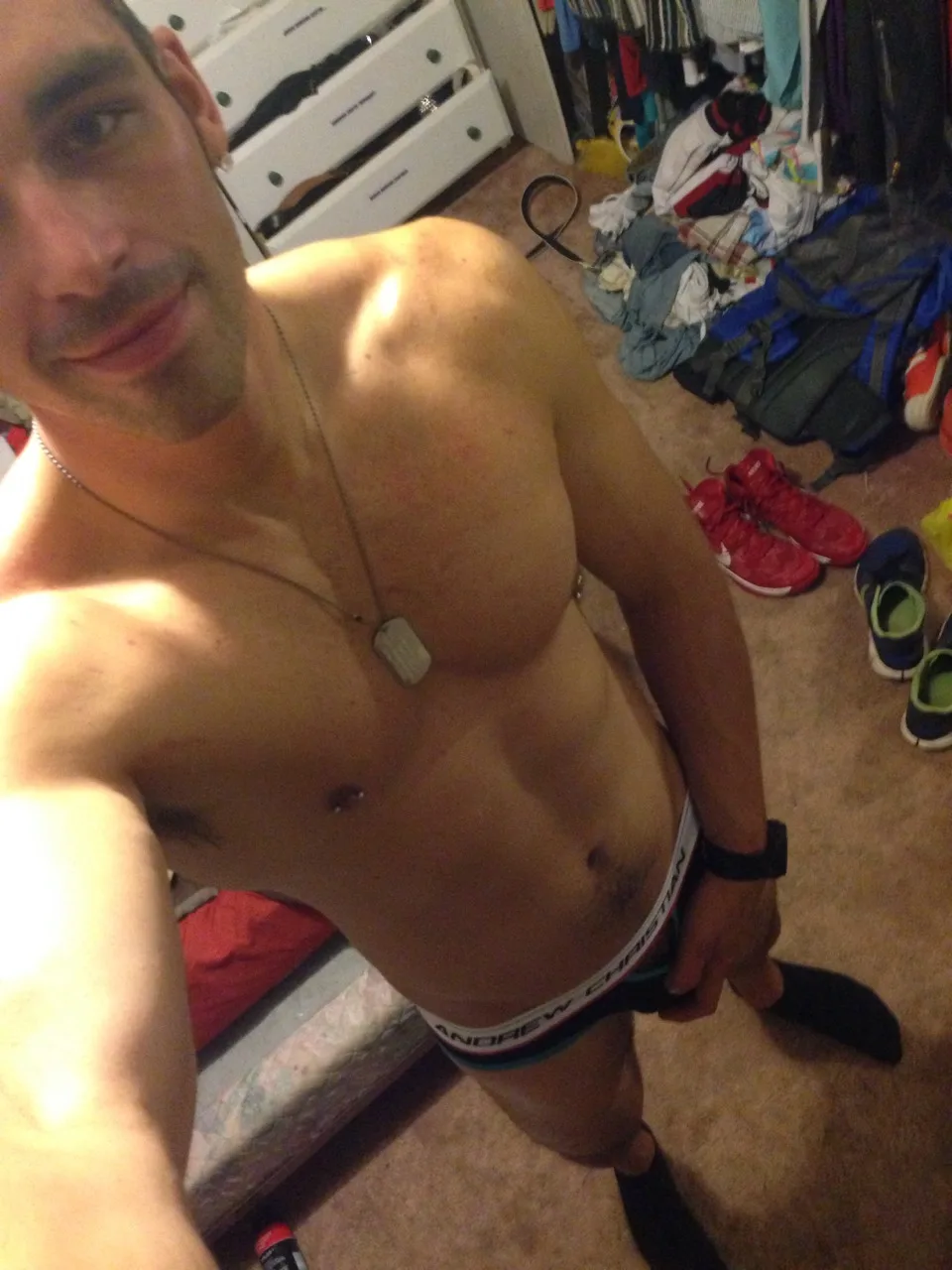 Hot amateur guy in Andrew Christian trunks takes a sexy bedroom selfie with messy room vibe