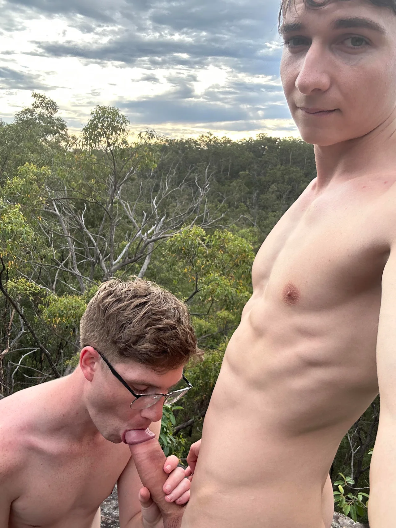 Hard cock sucked bareback outdoors as dude stares down the lens with a smirk