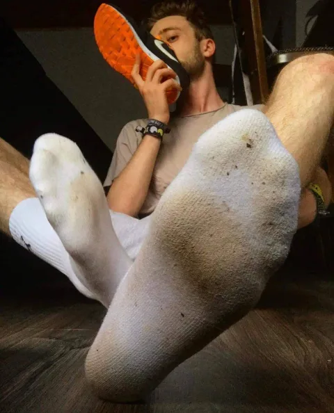 Dirty socked feet in your face, dude licks sneaker sole with messy soles on display