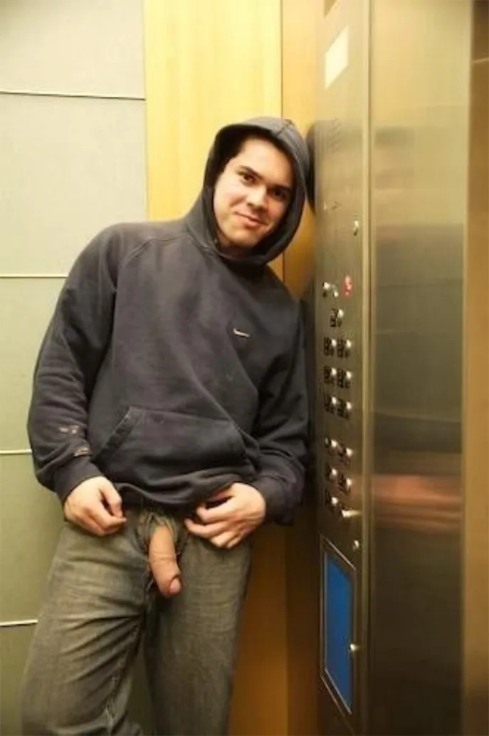 Amateur guy in hoodie pulls pants down in elevator, hard cock out for the camera